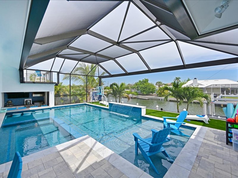 Pool, spa, and outdoor lounge at The Stumbling Iguana
