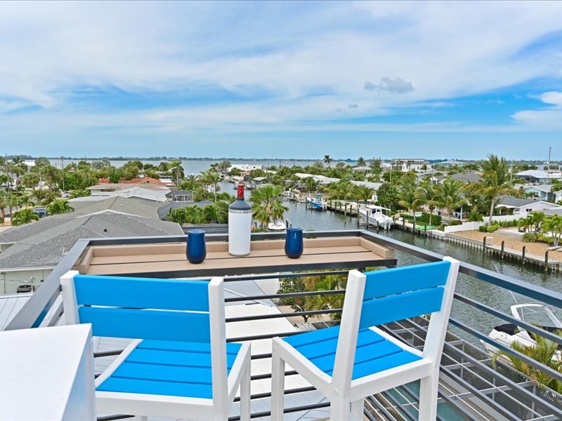 Rooftop chairs facing the bay